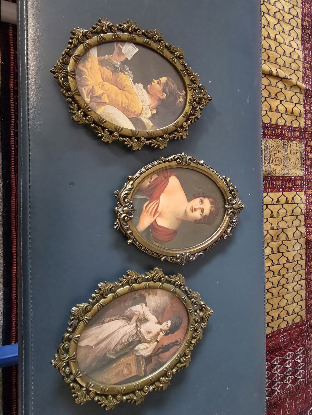 three vintage Italian ornate gold-toned metal and rococo-style oval Frames